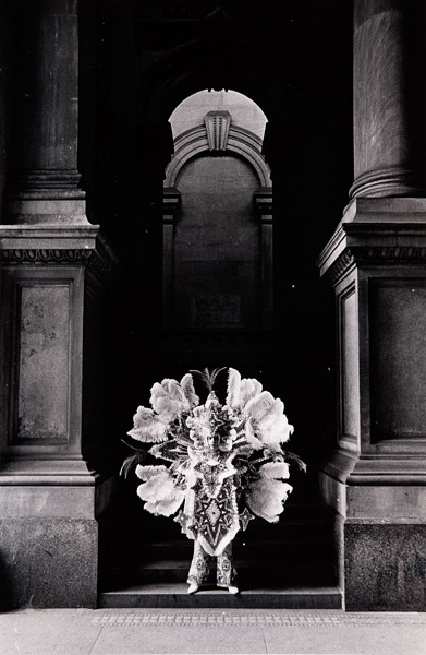 George Krause: [Mummer in archway of Philadelphia City Hall] (Undated) Gelatin silver print